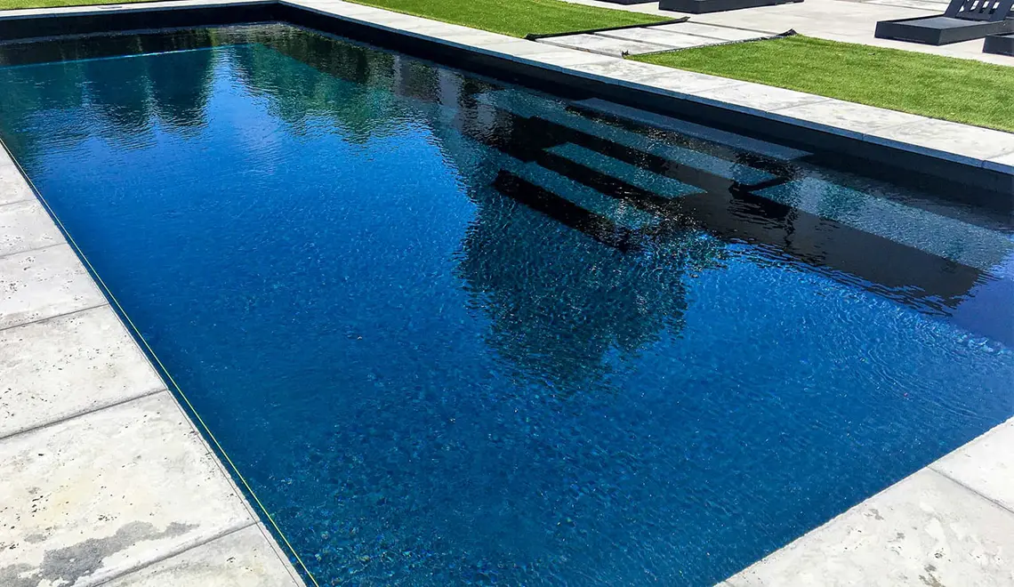 The Grand rectangular fiberglass pool with great side entry steps from Leisure Pools Sarasota